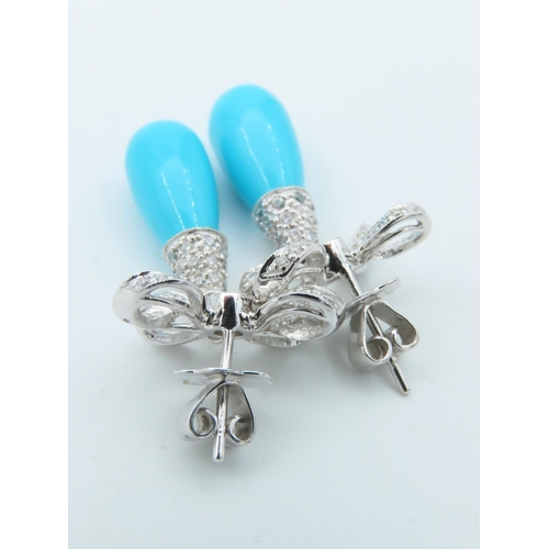 720 - Pair of Diamond and Turquoise Bow Motif Drop Earrings Each Post Headed by a Milligrane Collet Set Ro... 