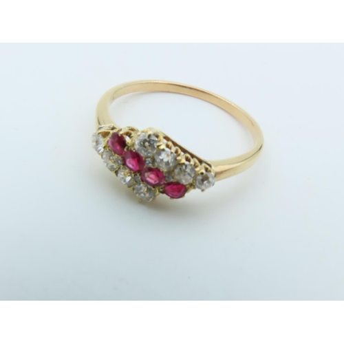 727 - Ruby and Diamond Ladies Ring Gentle Diagonal Line of Four Round Cut Rubies between Similar Lines of ... 