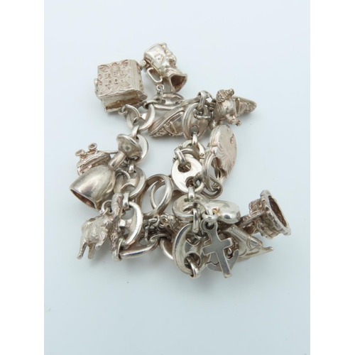 833 - Solid Silver Charm Bracelet Laden with Various Charms including Tankard and Other Motifs