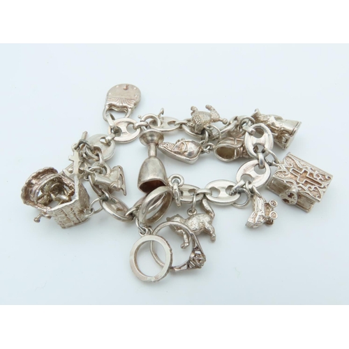 833 - Solid Silver Charm Bracelet Laden with Various Charms including Tankard and Other Motifs