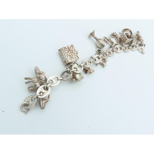 833 - Solid Silver Charm Bracelet Laden with Various Charms including Tankard and Other Motifs