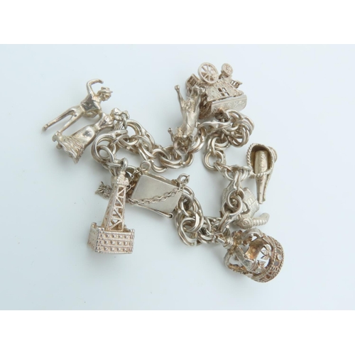 834 - Solid Silver Ladies Charm Bracelet Laden with Various Charms including Bull and Oil Well