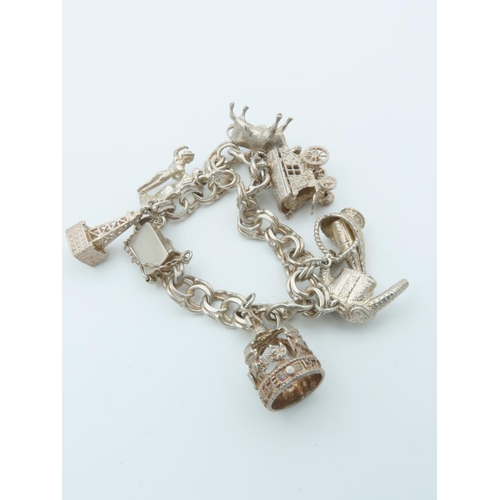 834 - Solid Silver Ladies Charm Bracelet Laden with Various Charms including Bull and Oil Well