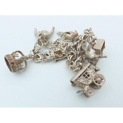 834 - Solid Silver Ladies Charm Bracelet Laden with Various Charms including Bull and Oil Well