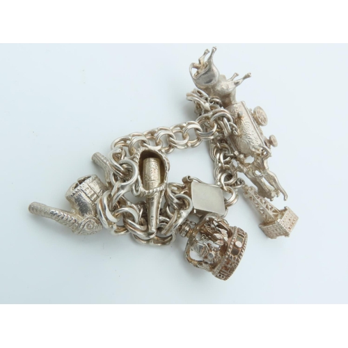 834 - Solid Silver Ladies Charm Bracelet Laden with Various Charms including Bull and Oil Well