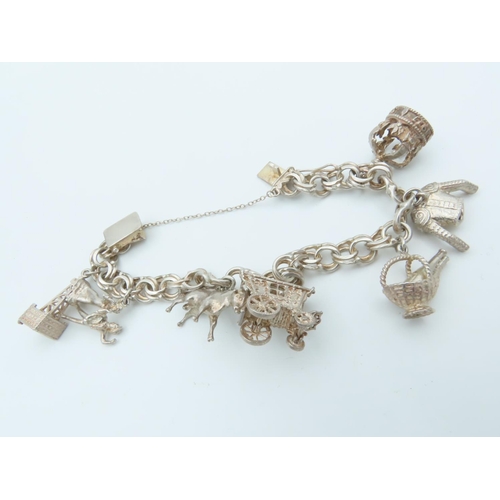 834 - Solid Silver Ladies Charm Bracelet Laden with Various Charms including Bull and Oil Well