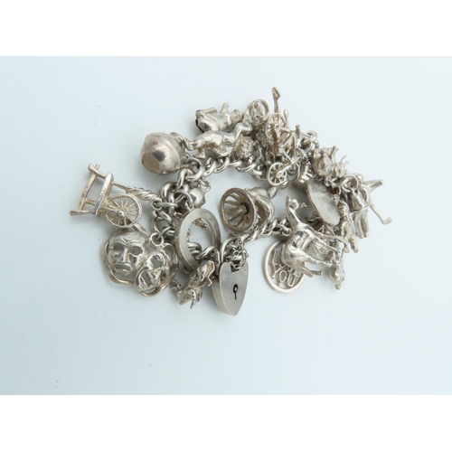 835 - Solid Silver Ladies Charm Bracelet Laden with Various Charms including Horse and Actors Motif