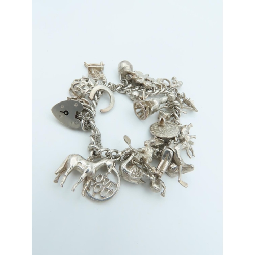 835 - Solid Silver Ladies Charm Bracelet Laden with Various Charms including Horse and Actors Motif