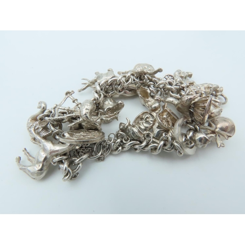 835 - Solid Silver Ladies Charm Bracelet Laden with Various Charms including Horse and Actors Motif