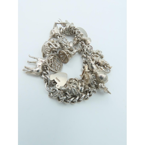 835 - Solid Silver Ladies Charm Bracelet Laden with Various Charms including Horse and Actors Motif