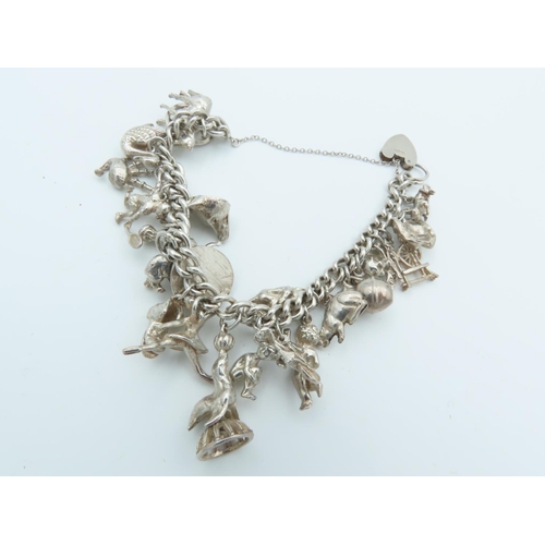 835 - Solid Silver Ladies Charm Bracelet Laden with Various Charms including Horse and Actors Motif