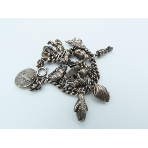 836 - Solid Silver Ladies Charm Bracelet Laden with Various Charms