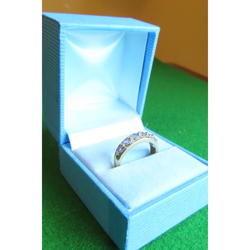 110 - 9 Carat Yellow Gold Half Eternity Ring Set with Seven Mauve Gemstones Size N and a Half