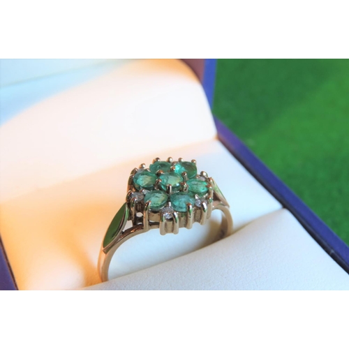 122 - Emerald and Diamond Ladies Cluster Ring Mounted on 9 Carat Yellow Gold Ring Size R