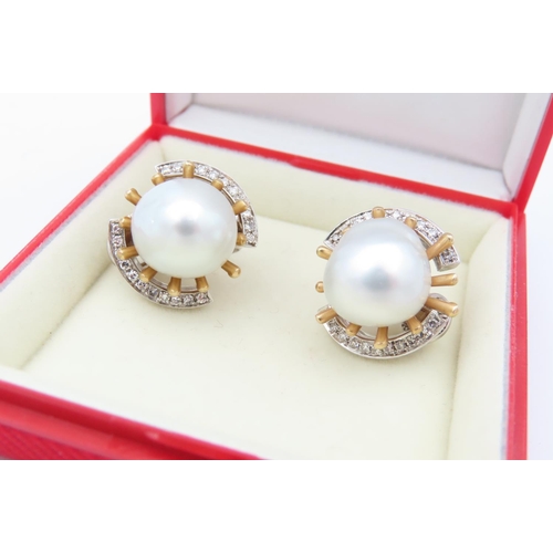 142 - Pair of 18 Carat Yellow Gold Mounted Vintage Pearl Earrings of Attractive Lustre with Diamond Surrou... 