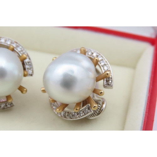 142 - Pair of 18 Carat Yellow Gold Mounted Vintage Pearl Earrings of Attractive Lustre with Diamond Surrou... 