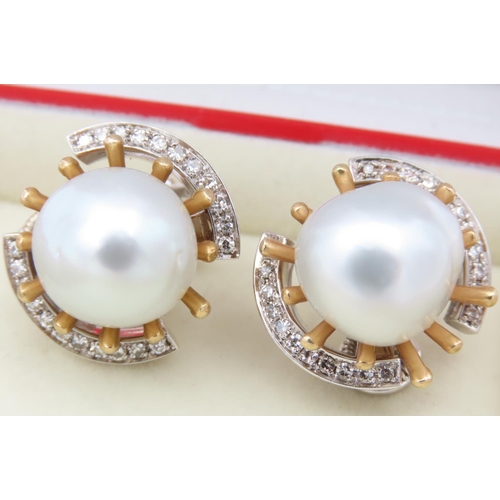 142 - Pair of 18 Carat Yellow Gold Mounted Vintage Pearl Earrings of Attractive Lustre with Diamond Surrou... 