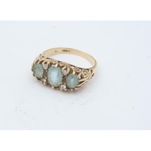 193 - 9 Carat Yellow Gold Aquamarine and Diamond Ladies Ring Three Oval Cut Aquamarines Interspersed with ... 