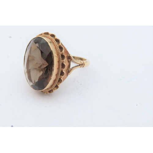 198 - Smokey Quartz Centre Stone Dress Ring Mounted on 9 Carat Gold Ring Size M