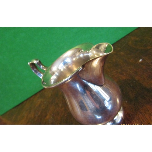 497 - Solid Silver Jug with Flying C Scrolled Handle above Pedestal Base Approximately 4 Inches High