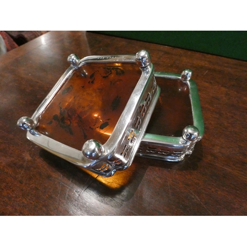 515 - Pair of Silver Plated Square Form Inverted Corner Canted Wine Bottle Table Top Coasters Resting on B... 