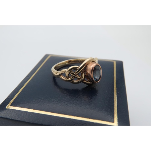 95 - Blue Topaz Ring Mounted on 9 Carat Gold Band with Celtic Intertwining Motifs