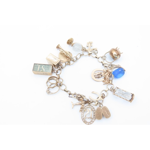 97 - 9 Carat Gold Ladies Charm Bracelet Mounted with Various 9 Carat Gold Charms including Canine and Equ... 