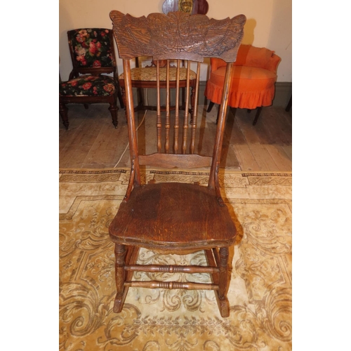 1046 - Antique Rocking Chair with Well Carved Back