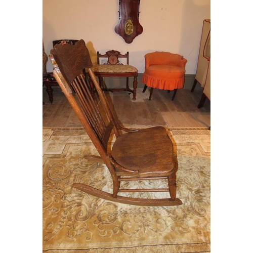 1046 - Antique Rocking Chair with Well Carved Back