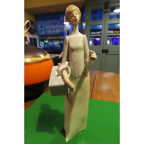 1057 - Lladro Fine Porcelain Figure of Lady with Parcel Approximately 11 Inches High Good Original Conditio... 