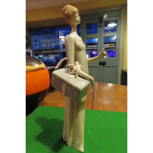 1057 - Lladro Fine Porcelain Figure of Lady with Parcel Approximately 11 Inches High Good Original Conditio... 