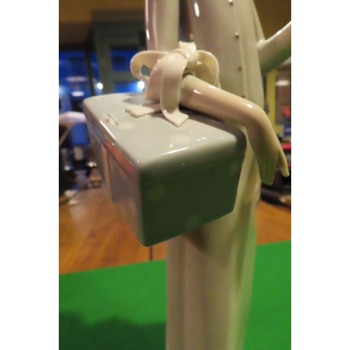 1057 - Lladro Fine Porcelain Figure of Lady with Parcel Approximately 11 Inches High Good Original Conditio... 