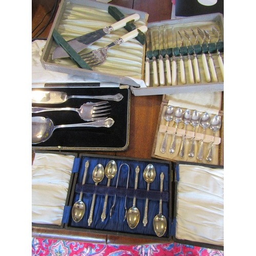 1074 - Four Boxes of Various Antique Silver Plated Flatware Antique including  Teaspoons and Serving Cutler... 