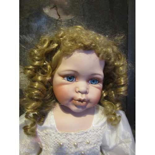 1203 - Porcelain Head Doll Approximately 24 Inches High