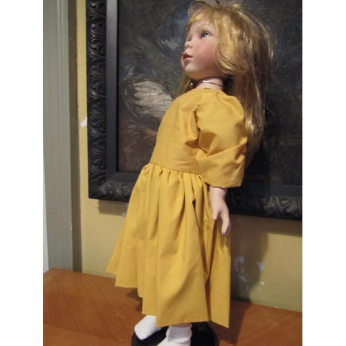 1205 - Porcelain Head Doll Approximately 24 Inches High