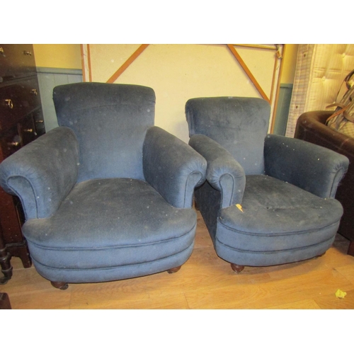 76 - Pair of Edwardian Rollarm Oversized Upholstered Armchairs