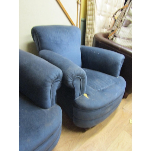 76 - Pair of Edwardian Rollarm Oversized Upholstered Armchairs