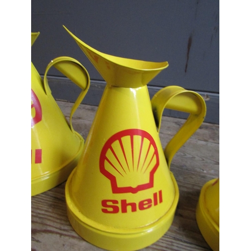 815 - Set of Five Enamel Decorated Shell Garage Oil Cans Graduated Form