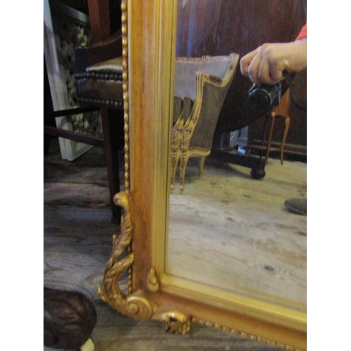 93 - Gilded Rectangular Form Wall Mirror with Carved Decoration Approximately 5ft 4 Inches High x 2ft 8 I... 