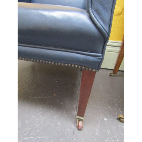 953 - Another Edwardian Navy Leather Upholstered Armchair Brass Cup Casters