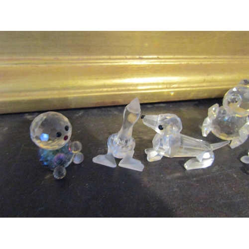 975 - Large Collection of Swarovski Crystal Figurines.