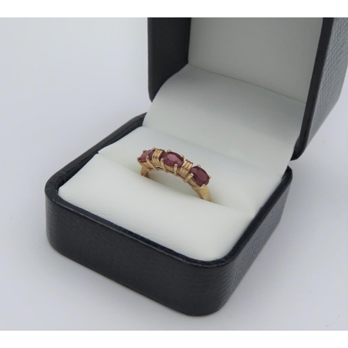 4 - 9 Carat Yellow Gold Ring Set with Three Oval Cut Rubies Approximately 1.4 Carats Ring Size N