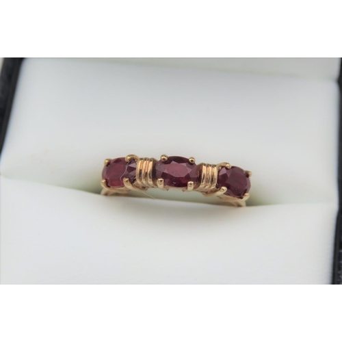 4 - 9 Carat Yellow Gold Ring Set with Three Oval Cut Rubies Approximately 1.4 Carats Ring Size N