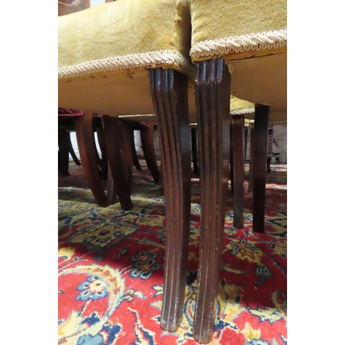 59 - Set of Sixteen Mahogany Dining Chairs Sabre Leg Supports Upholstered Seats Set includes Two Carvers ... 