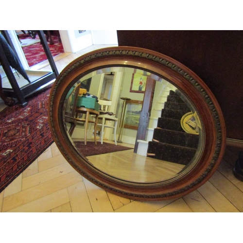 7 - Edwardian Walnut Oval Form Mirror Bevelled Plate Approximately 22 Inches Wide