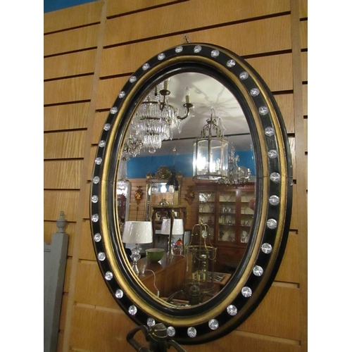 139 - Oval Form Crystal Mounted Wall Mirror with Gilded and Ebonised Decoration Approximately 26 Inches Hi... 