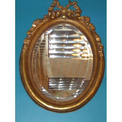 162 - Pair of Gilded Oval Form Wall Mirrors with Upper Ribbon Motif Decoration Each Approximately 22 Inche... 