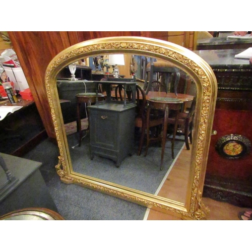 170 - Gilded Over Mantle Mirror Dome Form with Side Carved Decoration Approximately 4ft Wide x 4ft 6 Inche... 