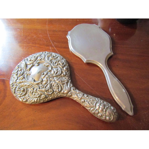 55 - Two Antique Silver Mounted Hand Mirrors One with Repouss_ Decoration Tallest Approximately 11 Inches... 