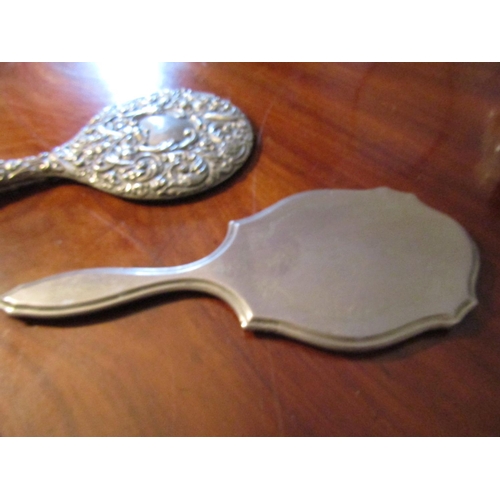 55 - Two Antique Silver Mounted Hand Mirrors One with Repouss_ Decoration Tallest Approximately 11 Inches... 